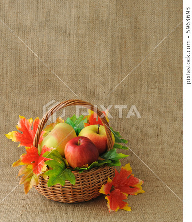 Basket of apples with autumn leaves 5963693