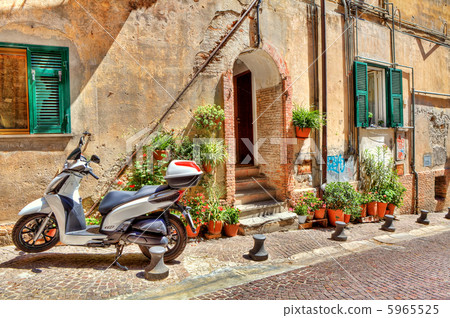 Motorcycle on cobbled street in Ventimiglia, Italy 5965525