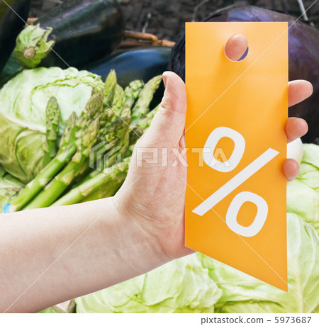 hand with a card for discounts 5973687