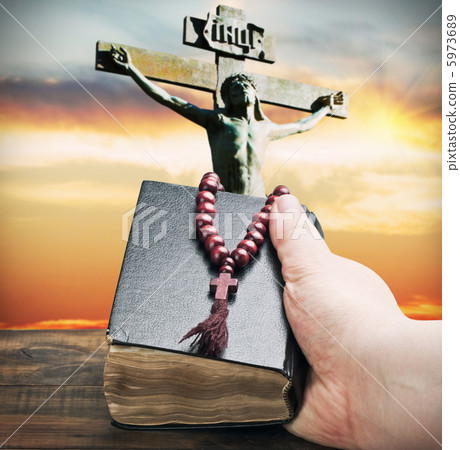 bible and wooden rosary in hand bible and wooden rosary in hand 5973689