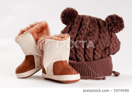 child winter boots and cap on a white background 5974098
