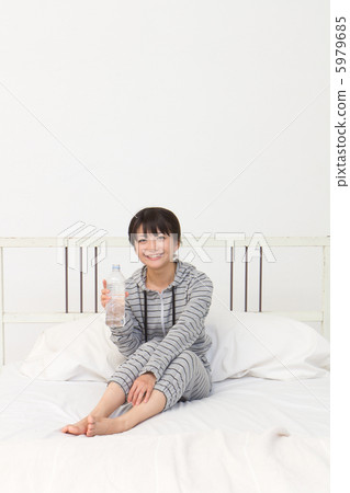 A woman drinking water 5979685
