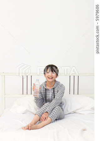 A woman drinking water 5979686