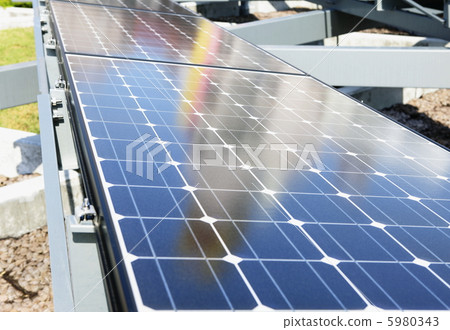 A landscape reflecting on a solar panel 5980343