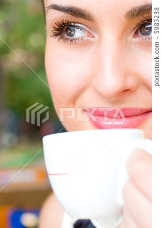Beautiful smiling woman drinking coffee 5983238