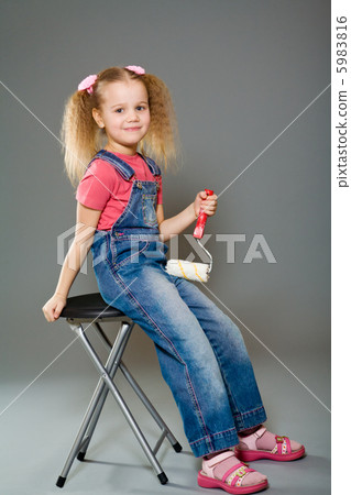 little girl holding paint roller 5983816