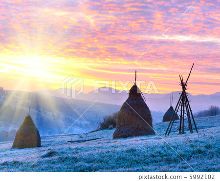 First autumn frosts and sunrise in mountain 5992102