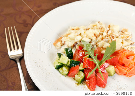 Scrambled eggs with salmon and vegetables Scrambled eggs with salmon and vegetables 5998138