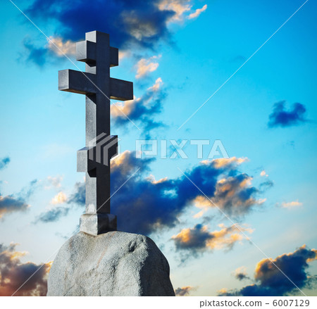 stone cross on the background of the dawn sky stone cross on the background of the dawn sky 6007129