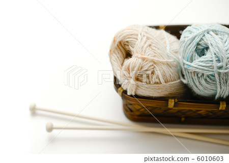 A basket of yarn and knitting needles A basket of yarn and knitting needles 6010603