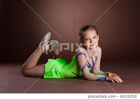 Young teen girl in green gymnast costume posing Young teen girl in green gymnast costume posing 6020208
