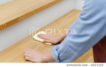 A woman cleaning a cloth A woman cleaning a cloth 6023105