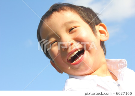A boy who laughs with a big mouth open A boy who laughs with a big mouth open 6027160