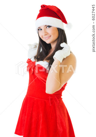 Beautiful woman in masquerade fashion and santa hat 6027445