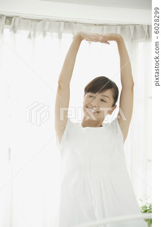 A woman stretching backwards 6028299