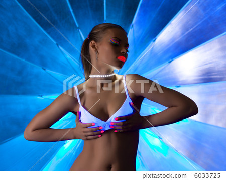 Sexy woman in disco dance with ultraviolet make-up 6033725