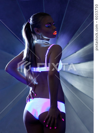 Beauty woman in dance with ultraviolet make-up 6033750