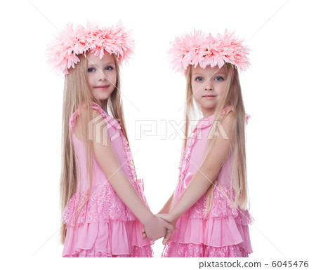 Two beautiful little girls in pink dresses Two beautiful little girls in pink dresses 6045476