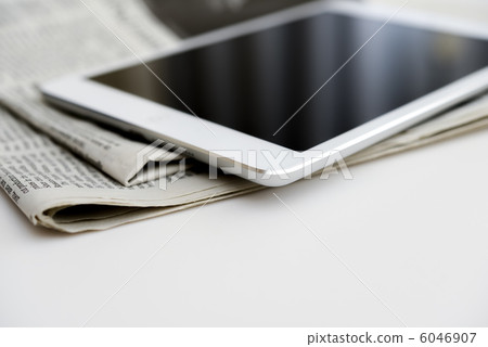 Tablet and newspaper Tablet and newspaper 6046907