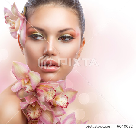 Beautiful Girl With Orchid Flowers. Perfect Make-up 6048082
