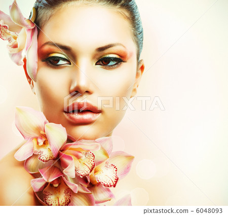 Beautiful Girl With Orchid Flowers. Beauty Woman Face Beautiful Girl With Orchid Flowers. Beauty Woman Face 6048093
