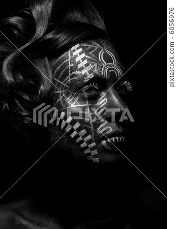 Savage religious woman voodoo, tattoo. Tribe. Painted face Savage religious woman voodoo, tattoo. Tribe. Painted face 6056976