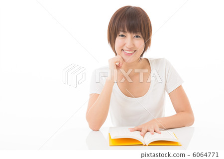 A woman reading a book A woman reading a book 6064771