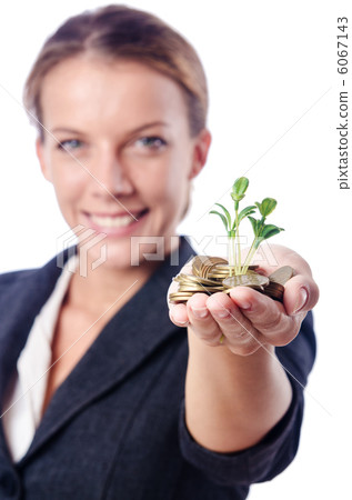 Businesswoman with seedlings and coins Businesswoman with seedlings and coins 6067143