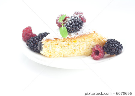 cup, cake, raspberry, blackberry,nuts and mint on a plate on a w 6070696