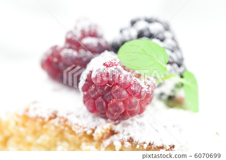 cup, cake, raspberry, blackberry,nuts and mint on a plate on a w 6070699