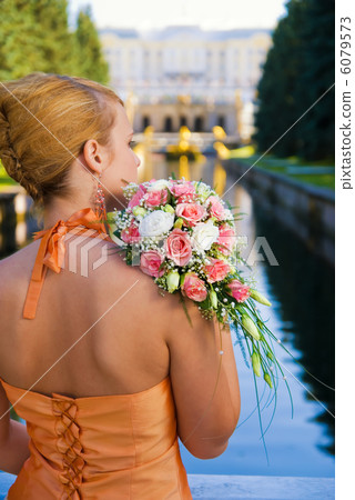 Young redhead girl with a bouquet of roses Young redhead girl with a bouquet of roses 6079573