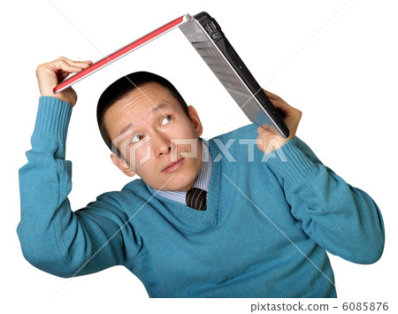 young businessman hides under the laptop young businessman hides under the laptop 6085876
