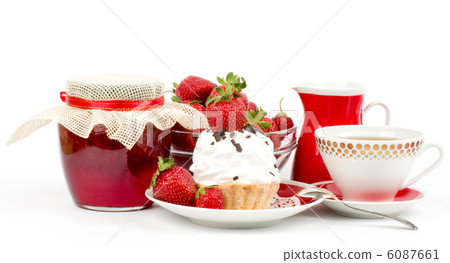 Dessert - sweet cake with strawberry and cherry on a plate on background 6087661