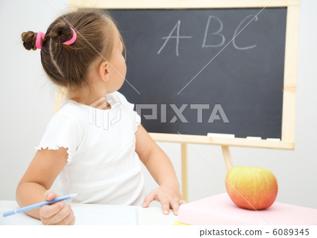 Little girl is studying Little girl is studying 6089345