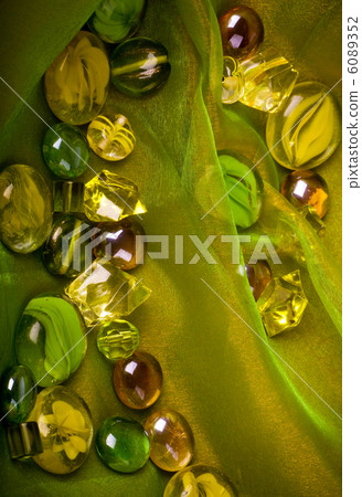 Beautiful bright colorful stones on a fabric Beautiful bright colorful stones on a fabric 6089352