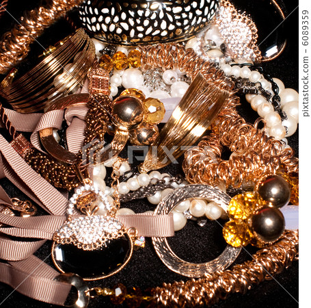 Golden jewelry background 6089359