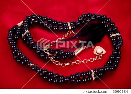 Pearl jewelry on red background 6090184