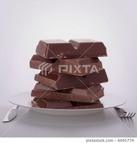 Chocolate bars stack on plate. Chocolate bars stack on plate. 6095774