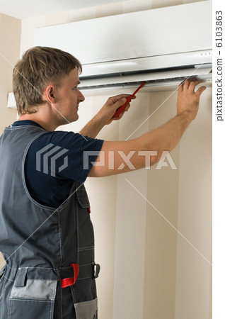 man repair air-conditioner 6103863