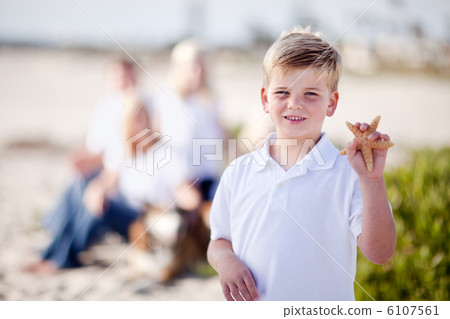 Cute Little Blonde Boy Showing Off His Starfish Cute Little Blonde Boy Showing Off His Starfish 6107561