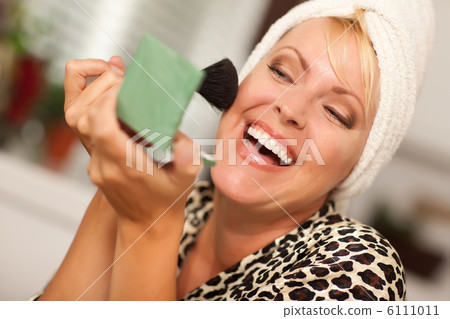 Blonde Woman Applying Her Makeup 6111011