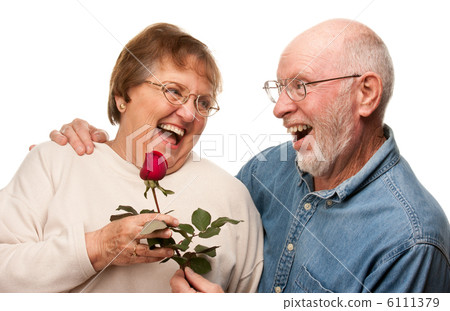 Happy Senior Husband Giving Red Rose to Wife Happy Senior Husband Giving Red Rose to Wife 6111379