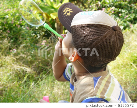 Boy playing soap bubble Boy playing soap bubble 6135572