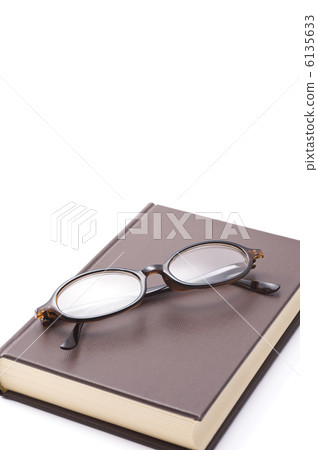 Closed books and glasses on white background Closed books and glasses on white background 6135633