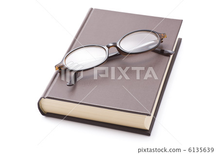 Closed books and glasses on white background Closed books and glasses on white background 6135639