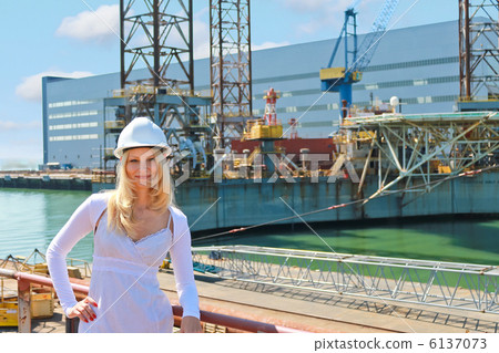 Woman engineer shipbuilder at the shipyard. Woman engineer shipbuilder at the shipyard. 6137073