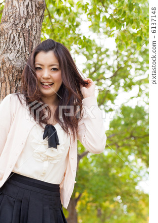 A woman relaxing in the park 6137148