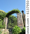 Gate of green and bricks 6137950