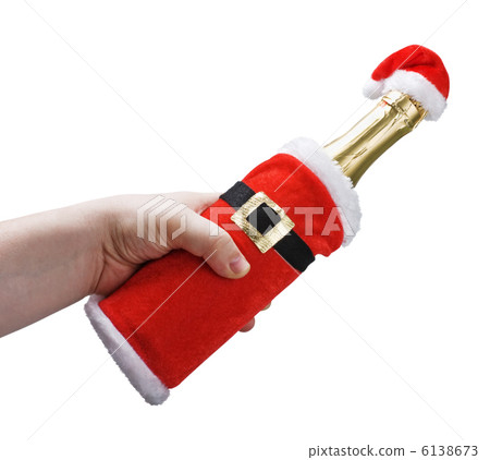 hand holding a champagne bottle in a Christmas decoration santa 6138673
