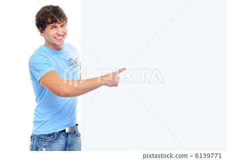 Happy  man showing on the white empty banner 6139771